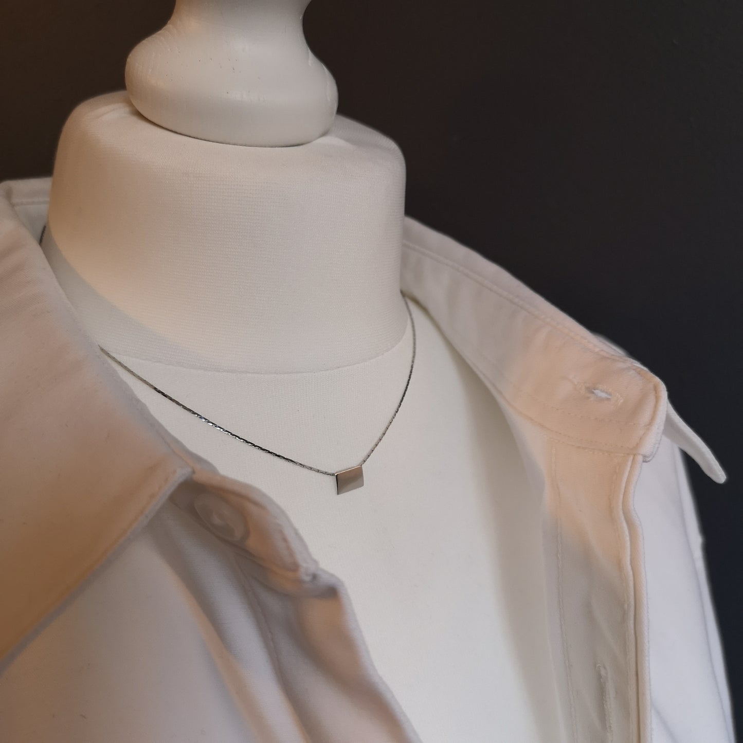 Finesse, the classic metal plate necklace.