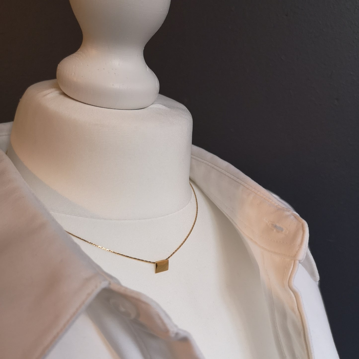 Finesse, the classic metal plate necklace.