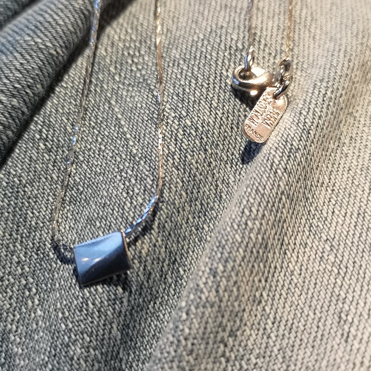 Finesse, the classic metal plate necklace.